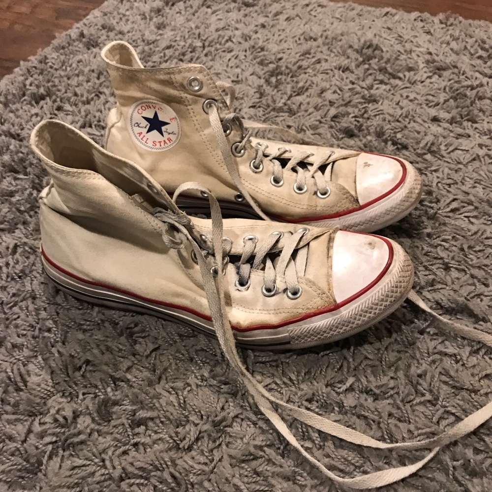 dirtied up white high top converse